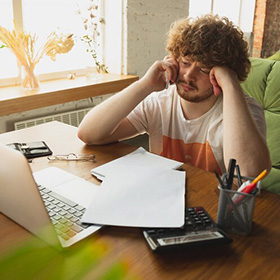 A Worried Man and a Desk