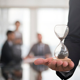 A Man Holding a Hand Clock