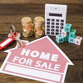 Home for Sale Banner on a Desk